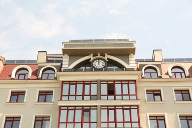 Modern building with glass windows outdoors, low angle view