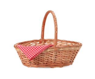 One picnic wicker basket with checkered napkin isolated on white