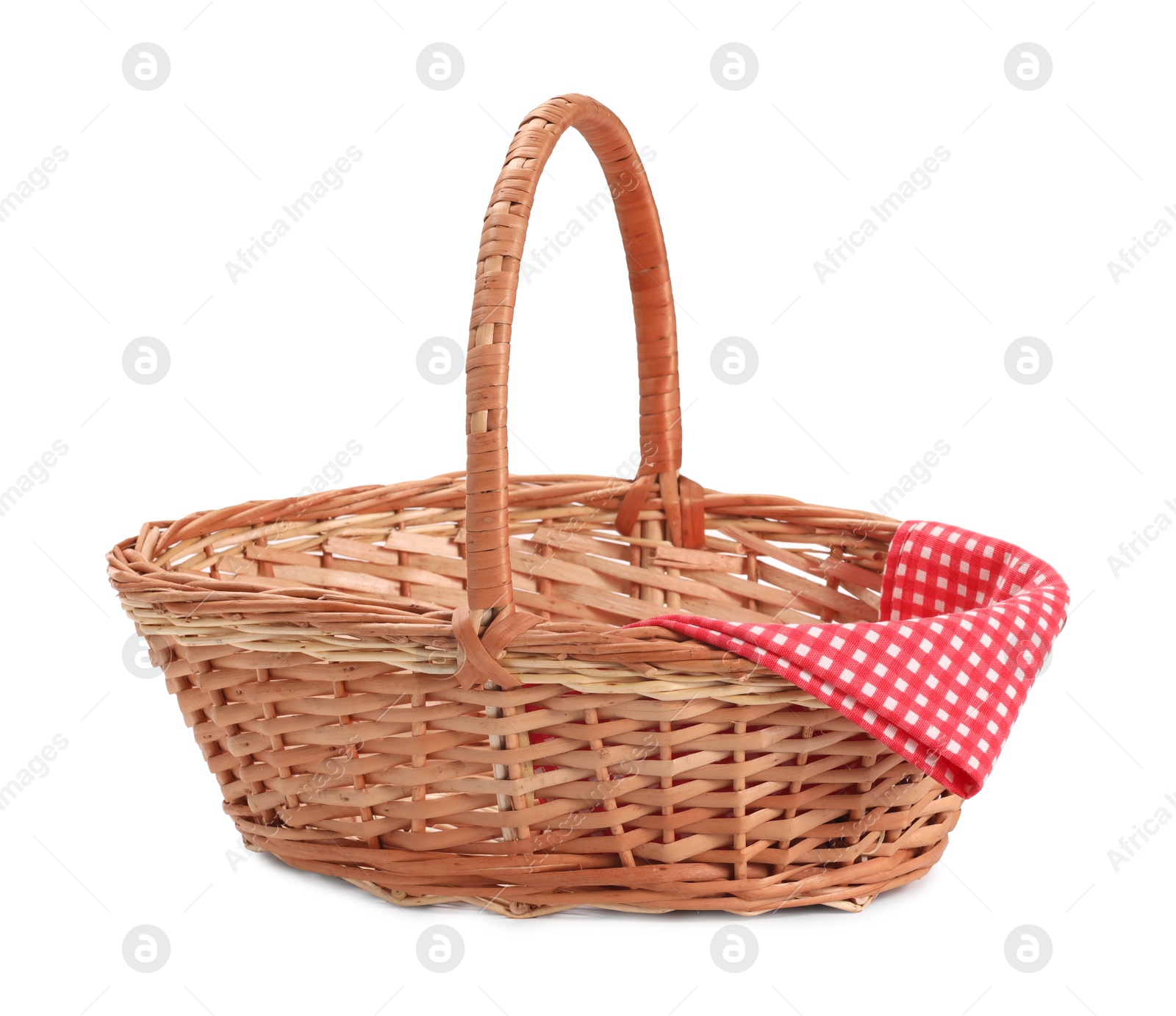 Photo of One picnic wicker basket with checkered napkin isolated on white