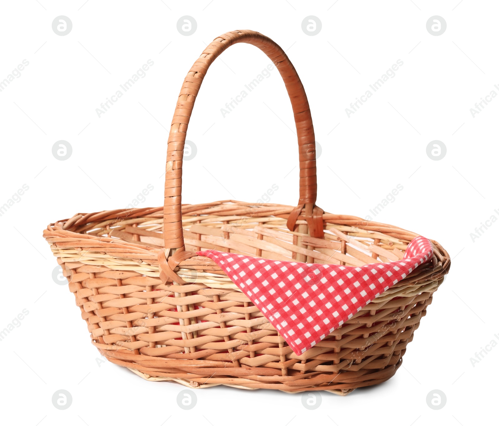 Photo of One picnic wicker basket with checkered napkin isolated on white