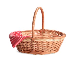 Photo of One picnic wicker basket with checkered napkin isolated on white