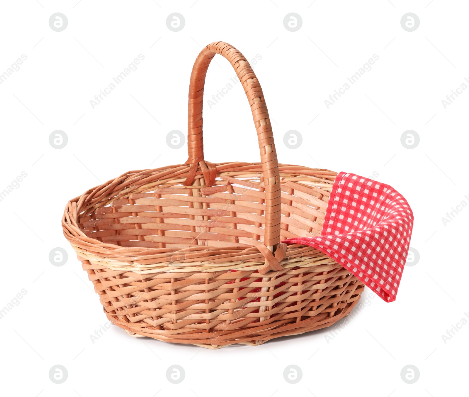 Photo of One picnic wicker basket with checkered napkin isolated on white