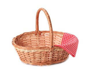 Photo of One picnic wicker basket with checkered napkin isolated on white