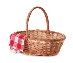 Photo of One picnic wicker basket with checkered napkin isolated on white