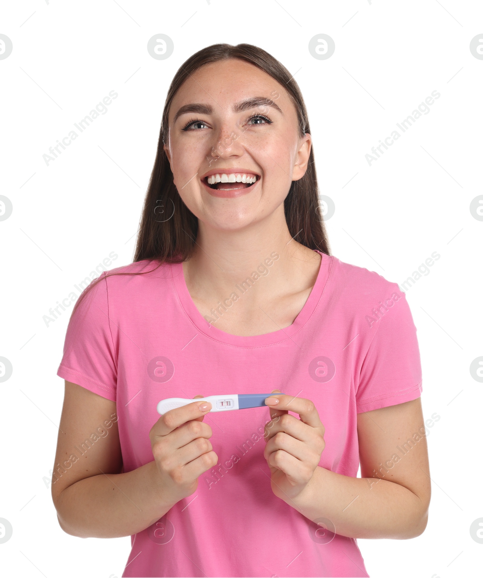 Photo of Happy woman holding pregnancy test on white background