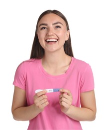 Happy woman holding pregnancy test on white background