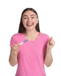 Happy woman holding pregnancy test on white background