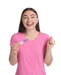 Photo of Happy woman holding pregnancy test on white background