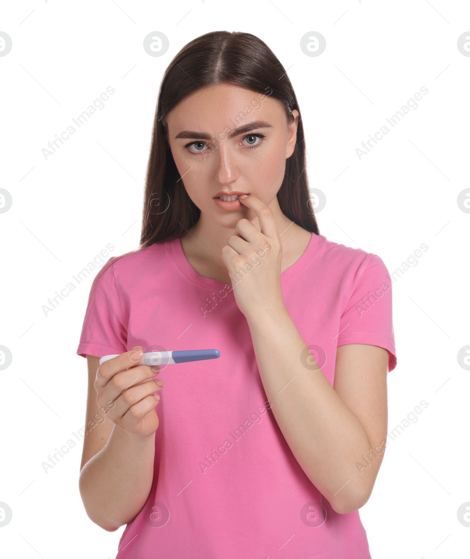 Photo of Confused woman holding pregnancy test on white background