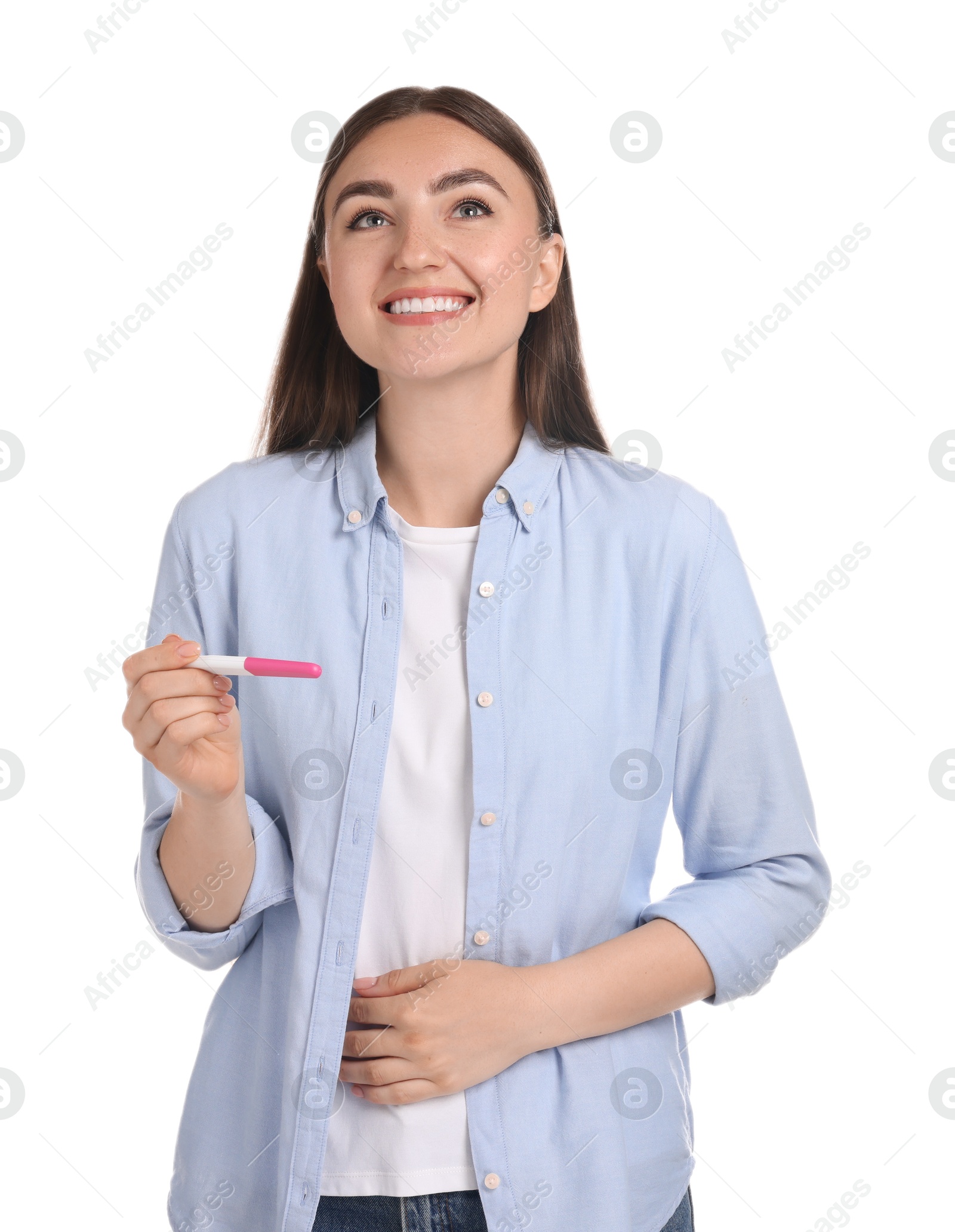 Photo of Happy woman holding pregnancy test on white background