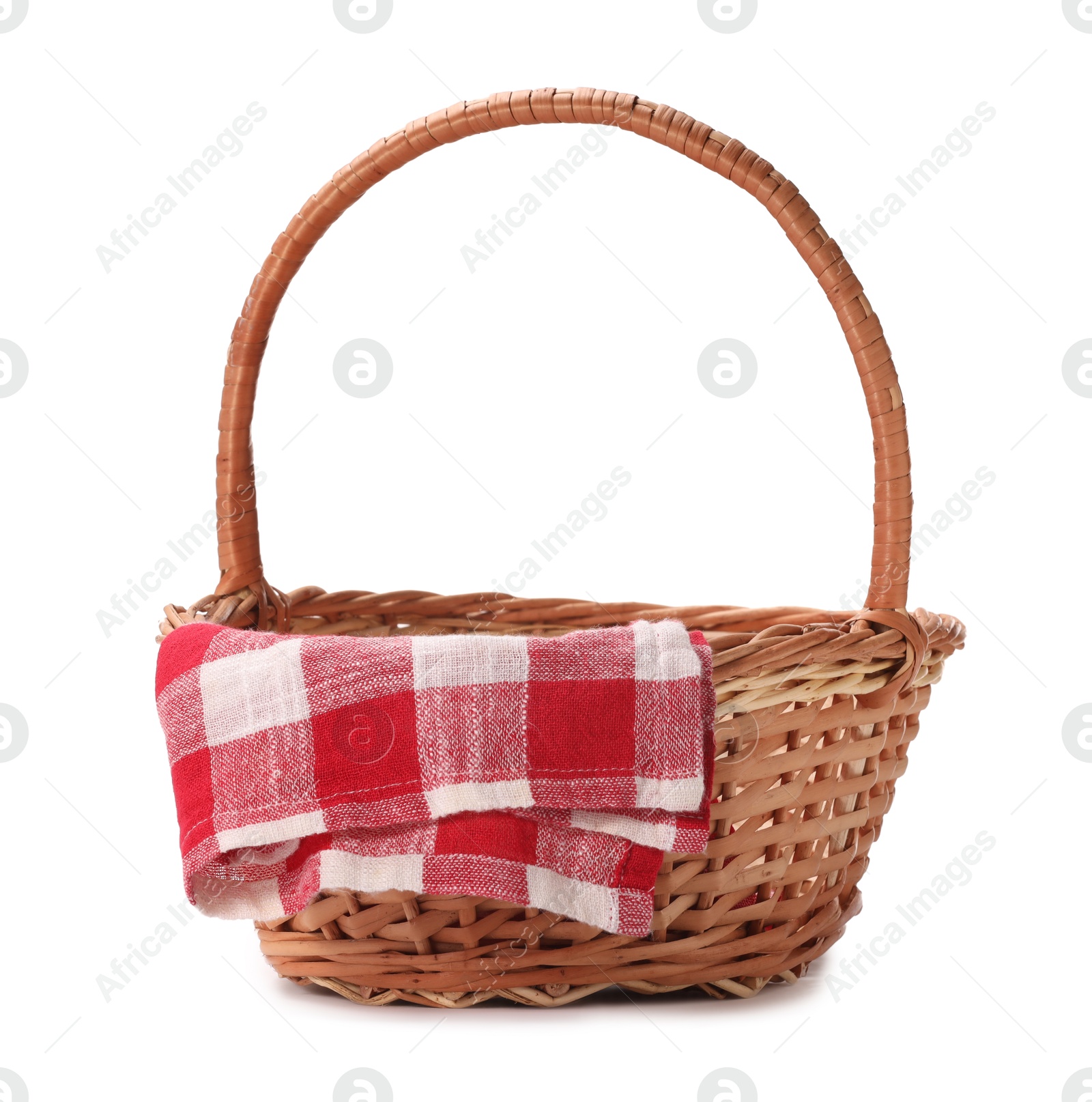 Photo of One picnic wicker basket with checkered napkin isolated on white