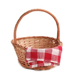 Photo of One picnic wicker basket with checkered napkin isolated on white