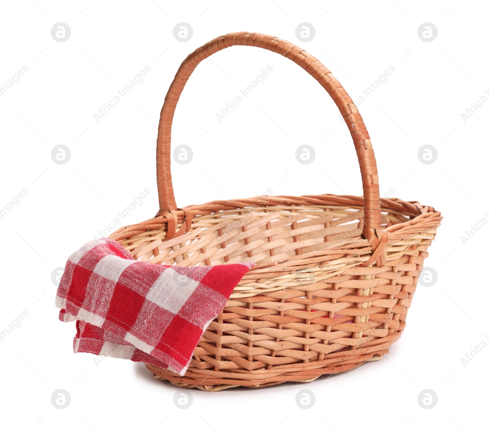 Photo of One picnic wicker basket with checkered napkin isolated on white