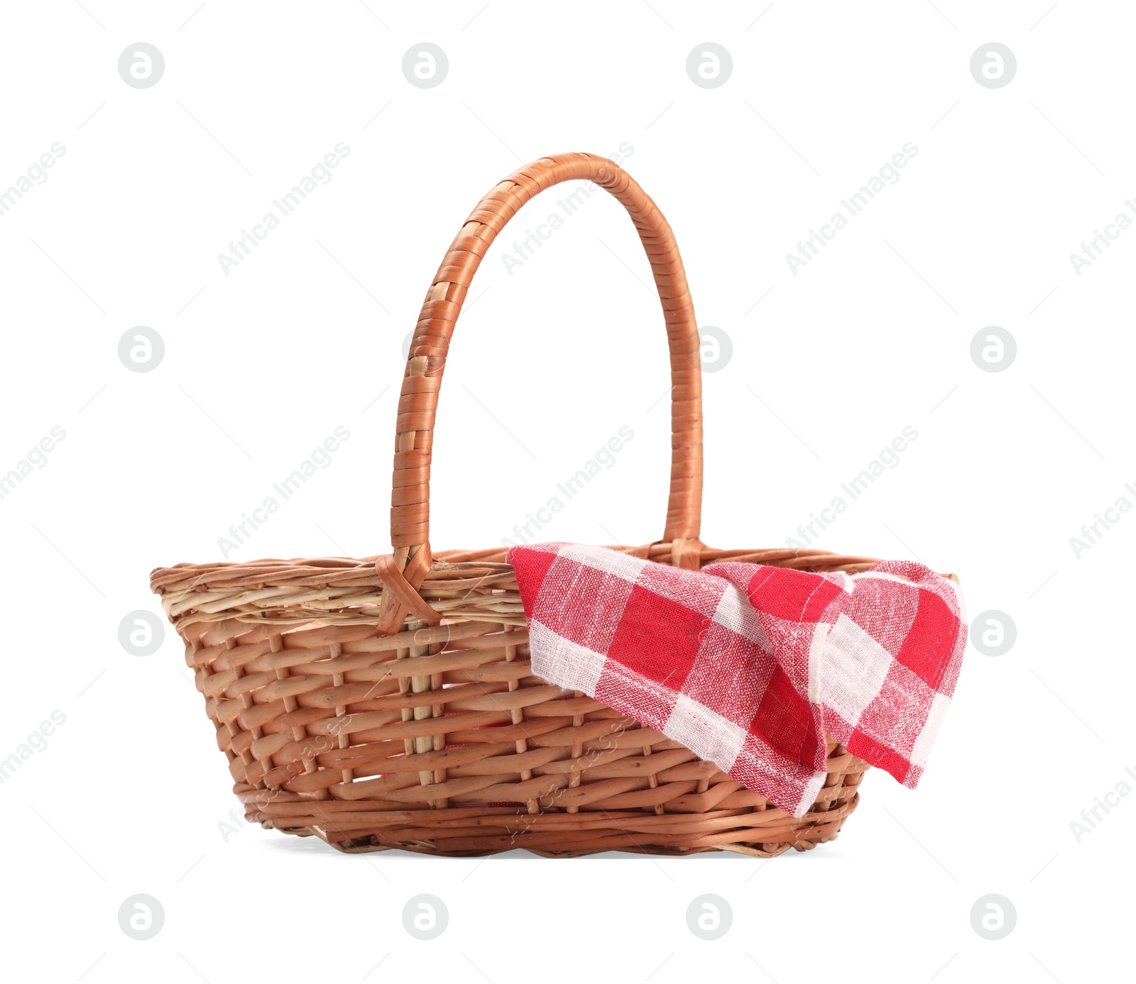 Photo of One picnic wicker basket with checkered napkin isolated on white