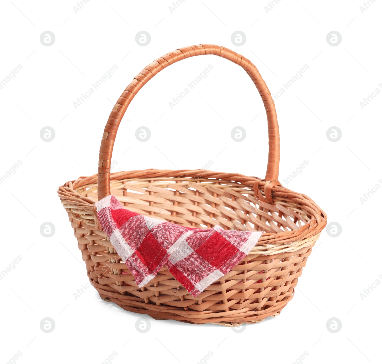 Photo of One picnic wicker basket with checkered napkin isolated on white