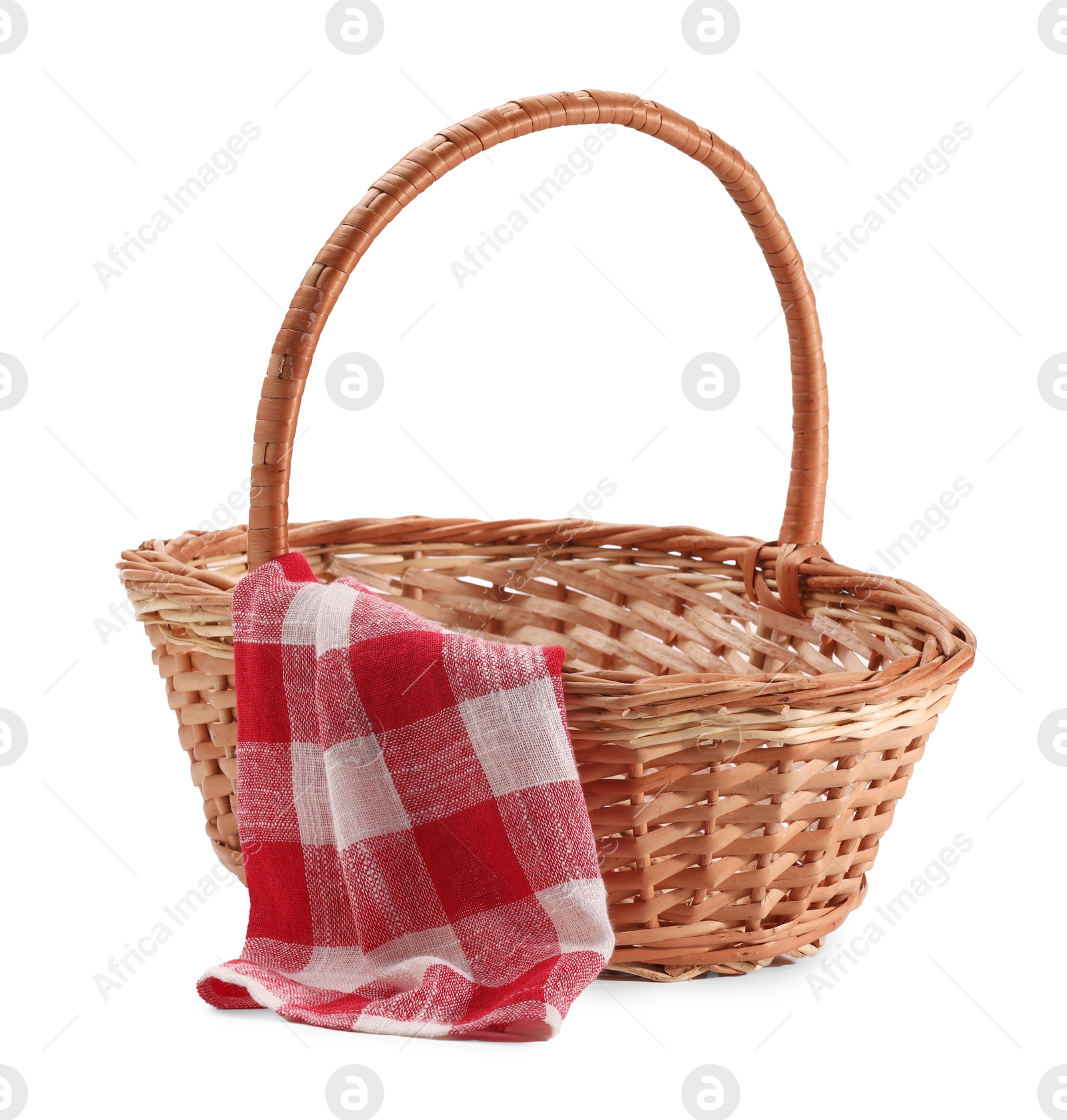 Photo of One picnic wicker basket with checkered napkin isolated on white