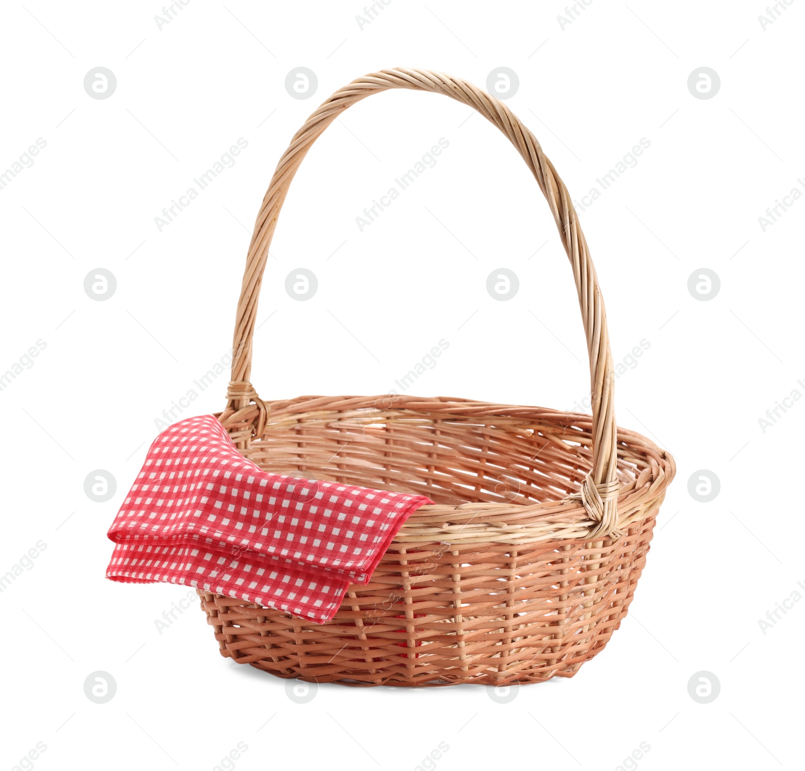 Photo of One picnic wicker basket with checkered napkin isolated on white