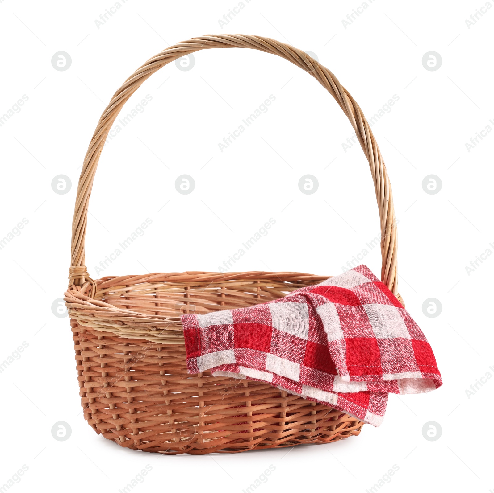 Photo of One picnic wicker basket with checkered napkin isolated on white