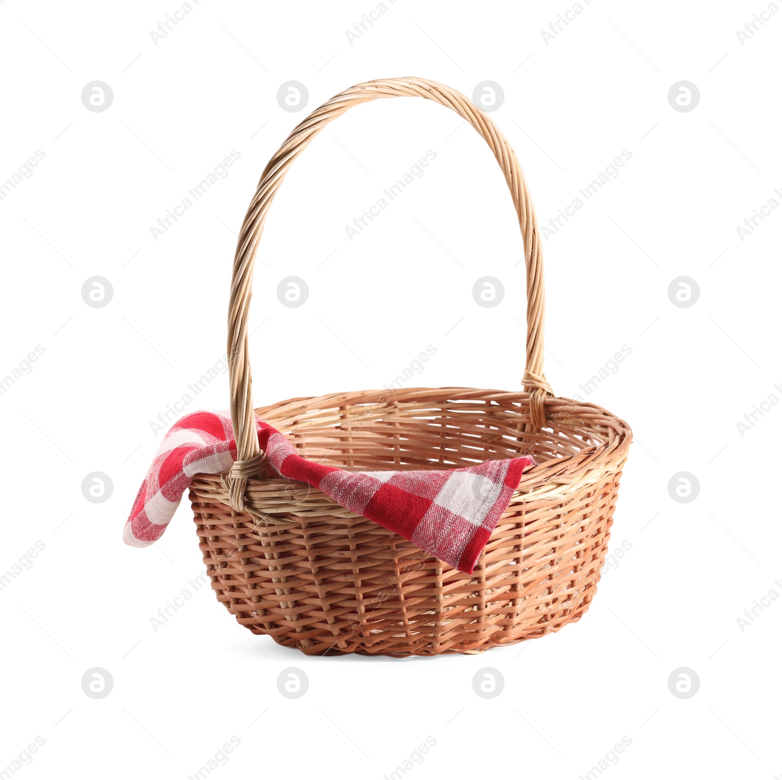 Photo of One picnic wicker basket with checkered napkin isolated on white