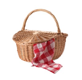 Photo of One picnic wicker basket with checkered napkin isolated on white