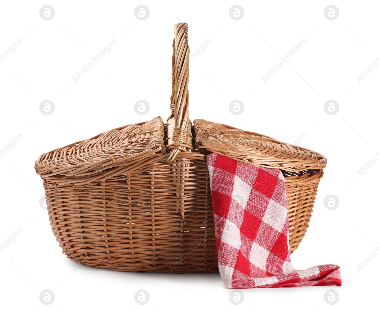 Photo of One picnic wicker basket with checkered napkin isolated on white