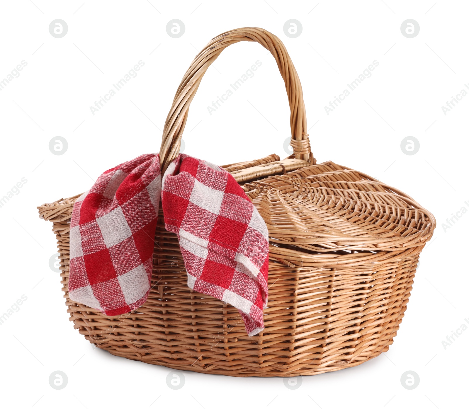 Photo of One picnic wicker basket with checkered napkin isolated on white