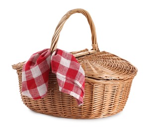 Photo of One picnic wicker basket with checkered napkin isolated on white