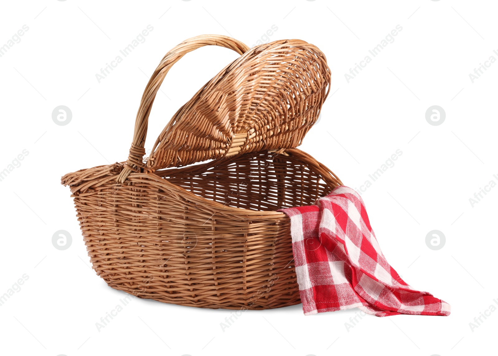 Photo of One open picnic wicker basket with checkered napkin isolated on white