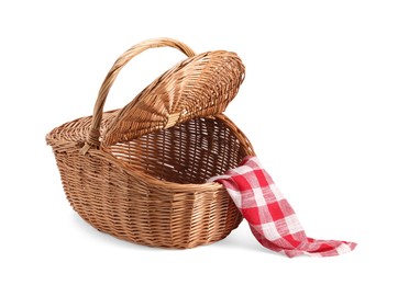 Photo of One open picnic wicker basket with checkered napkin isolated on white