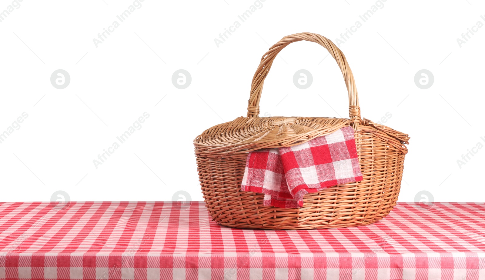 Photo of One picnic basket with napkin on table against white background. Space for text