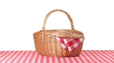 Photo of One picnic basket with napkin on table against white background