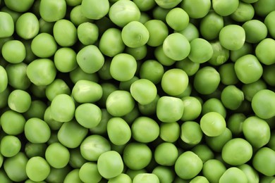 Photo of Fresh green peas as background, top view