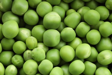 Photo of Fresh green peas as background, above view