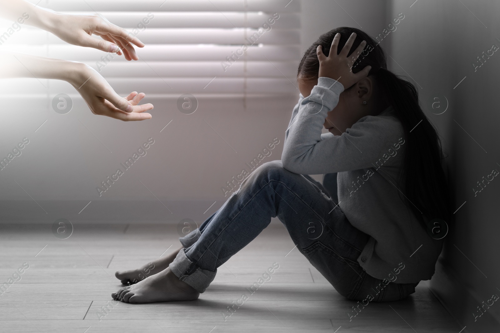 Image of Woman lending hands to sad child indoors. Trust, support, help