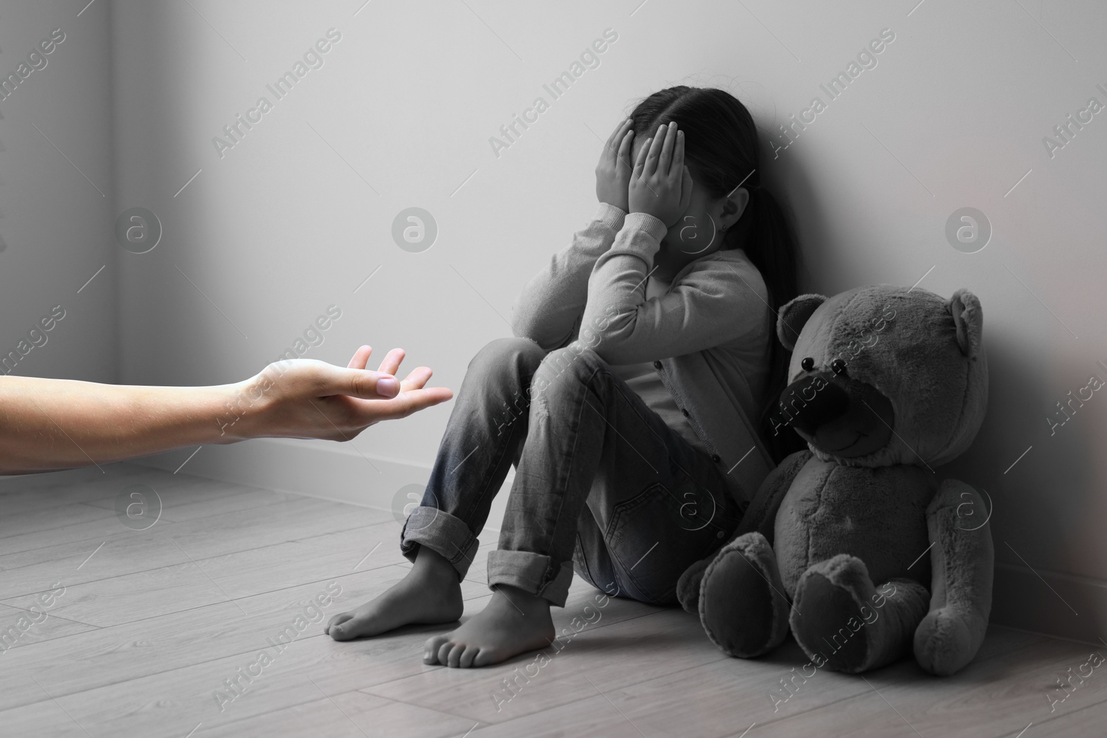 Image of Man offering hand to sad child indoors. Trust, support, help