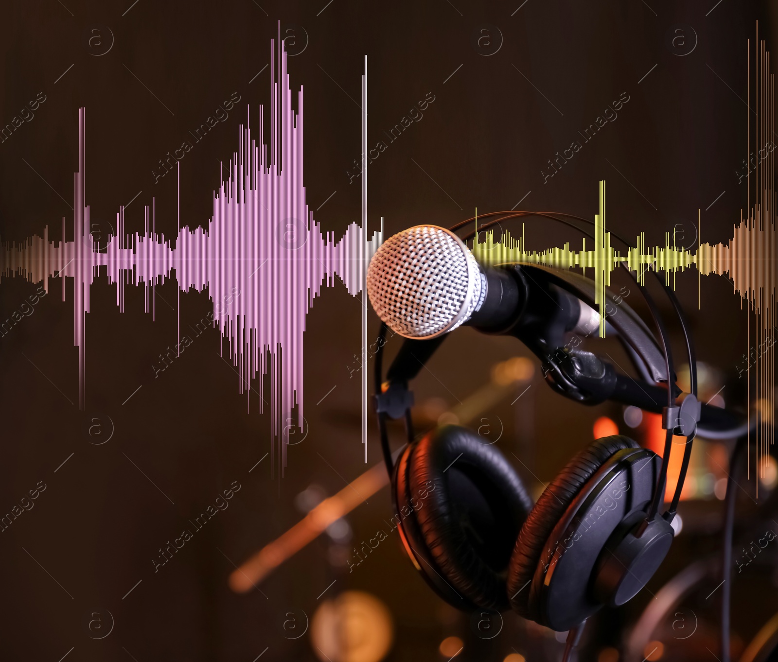 Image of Microphone, headphones and audio waveform in record studio