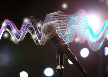 Image of Microphone and sound waves on blurred background