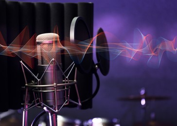 Image of Microphone and sound waves in record studio