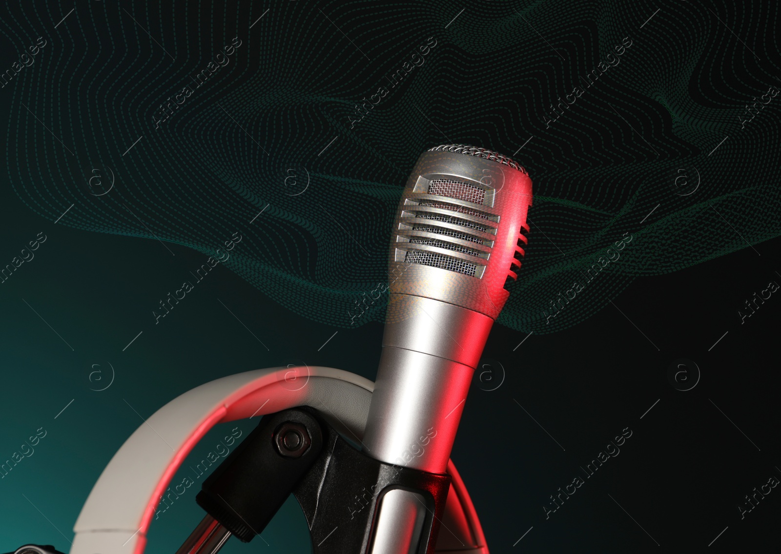 Image of Microphone and sound waves on dark background