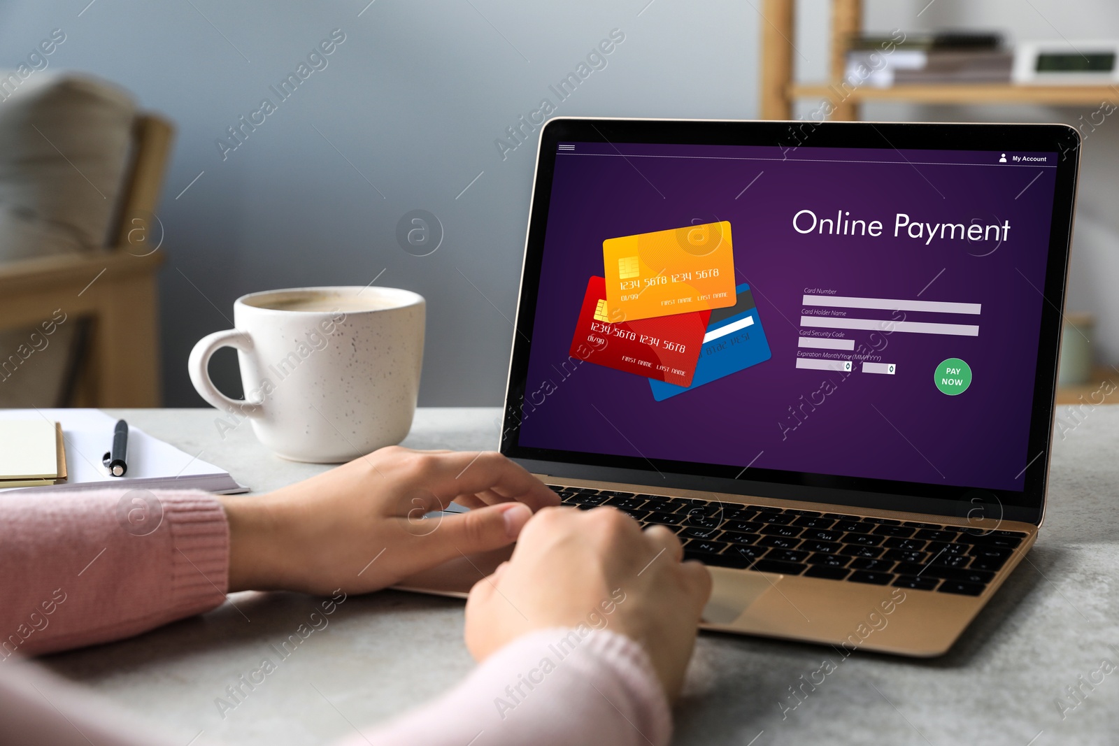 Image of Woman using online payment application on laptop at home, closeup