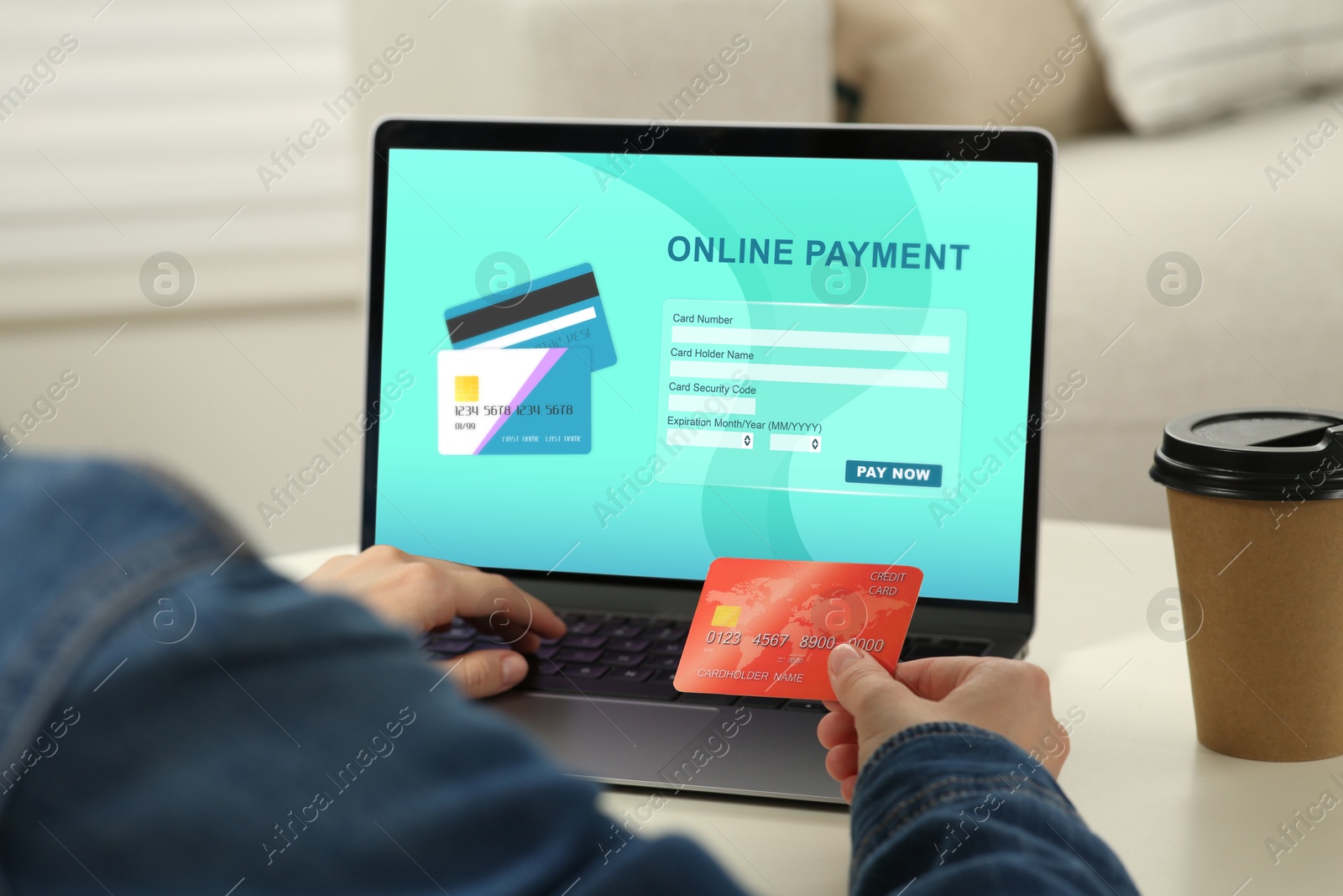 Image of Woman using online payment application on laptop at home, closeup