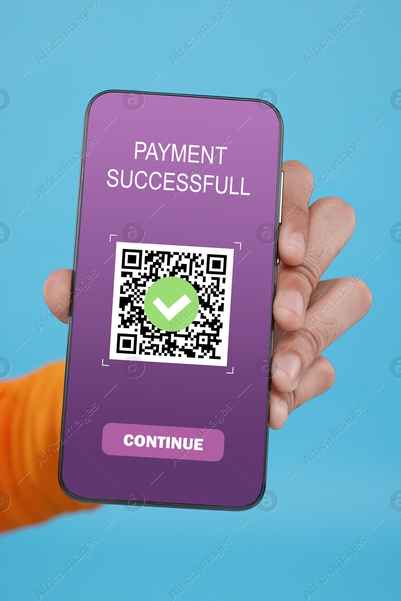 Image of Man using online payment application on mobile phone against light blue background, closeup