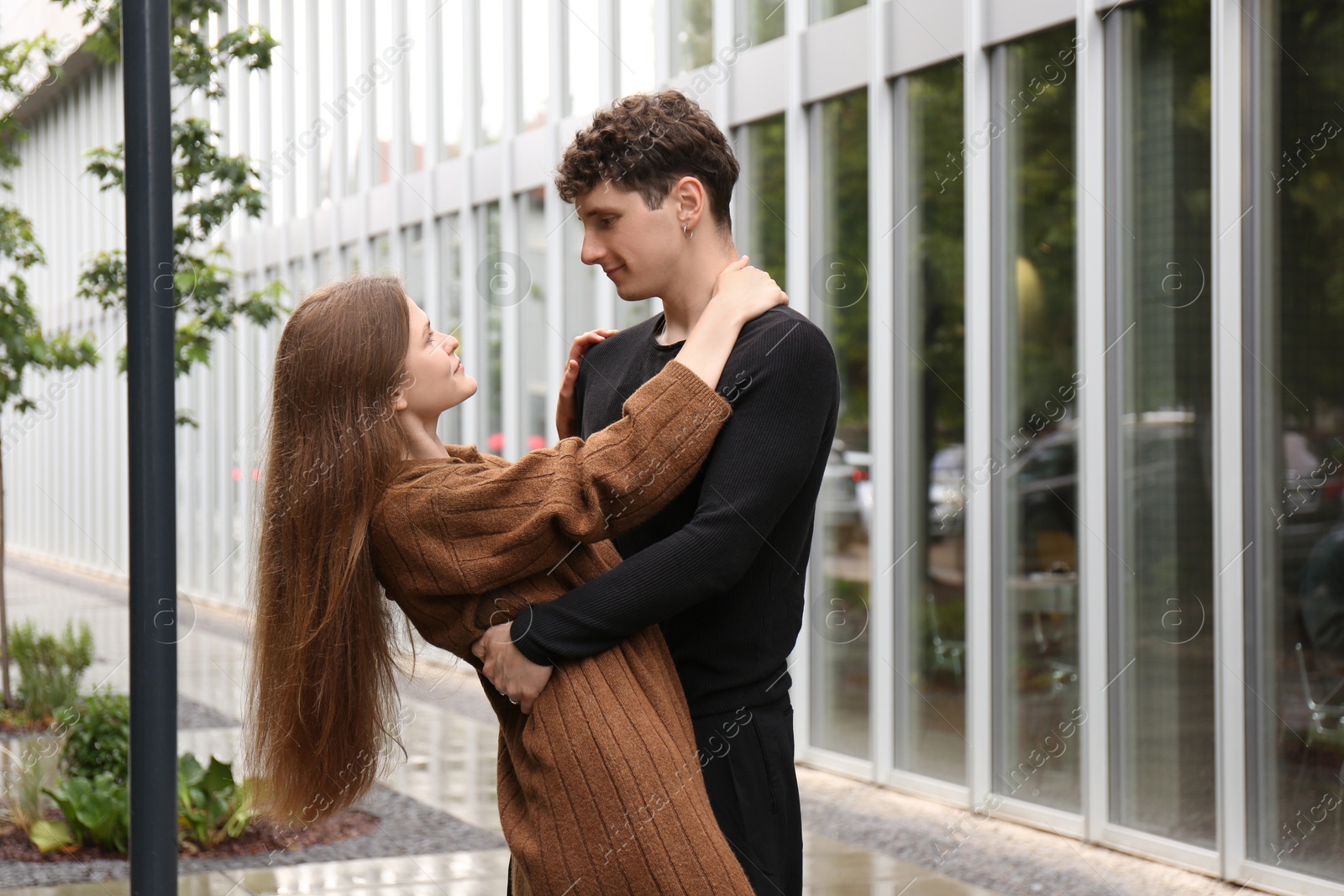 Photo of International dating. Lovely young couple spending time together outdoors, space for text