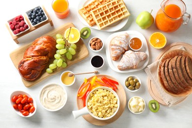 Photo of Tasty breakfast. Flat lay composition with many different food on light table