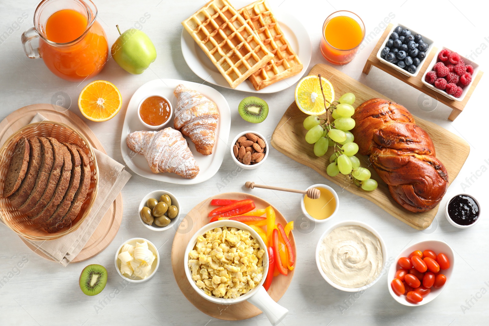 Photo of Tasty breakfast. Flat lay composition with many different food on light table