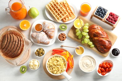 Photo of Tasty breakfast. Flat lay composition with many different food on light table