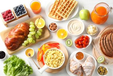 Photo of Tasty breakfast. Flat lay composition with many different food on light table