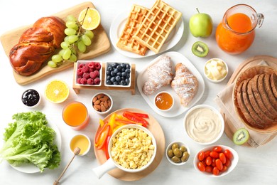 Photo of Tasty breakfast. Flat lay composition with many different food on light table