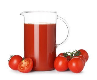 Tasty tomato juice in glass jug and fresh vegetables isolated on white