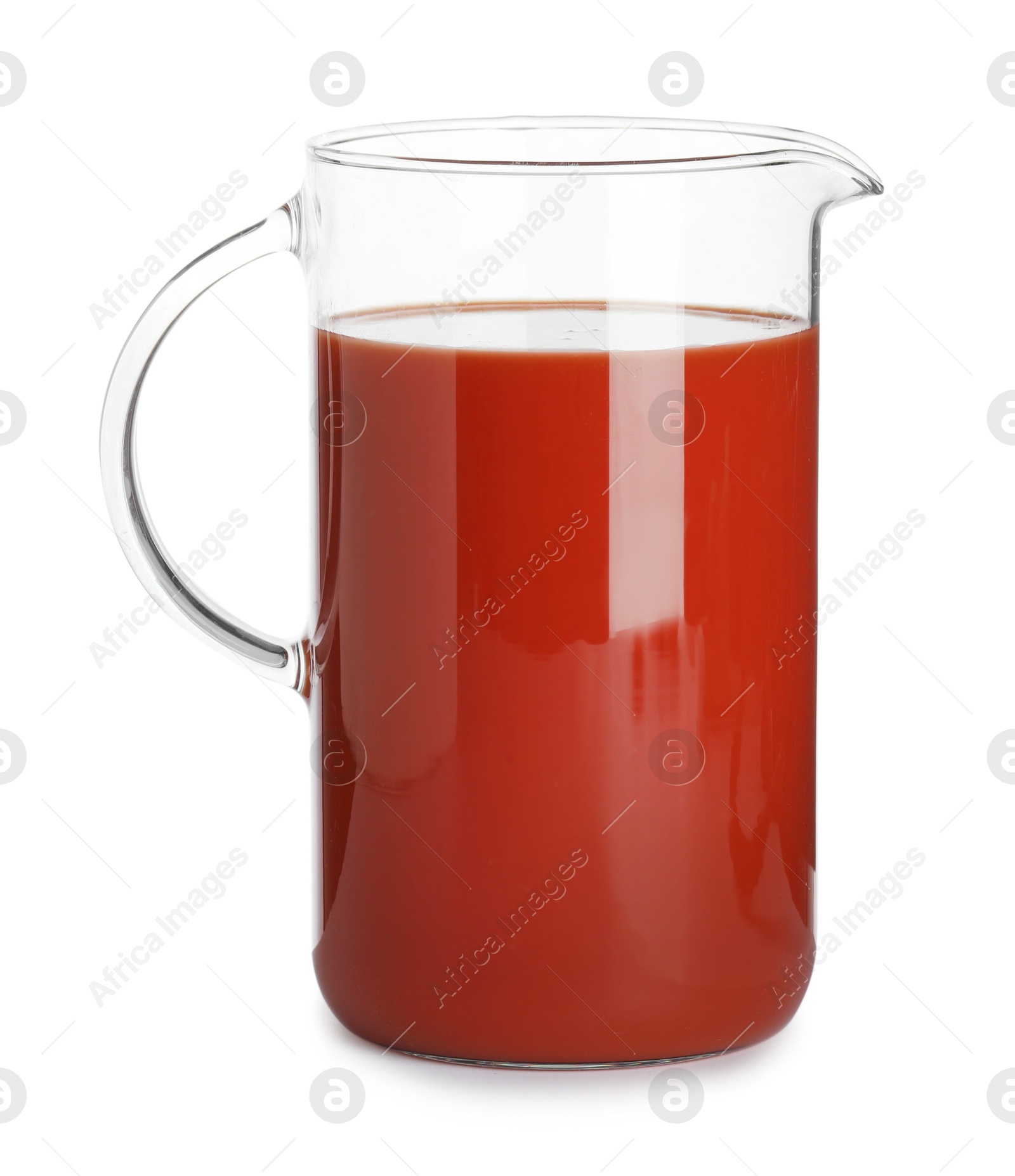 Photo of Fresh tomato juice in glass jug isolated on white